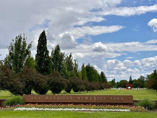 Park with water splash pad and statue