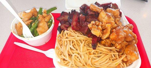 String bean chicken, pork, and orange chicken with noodles