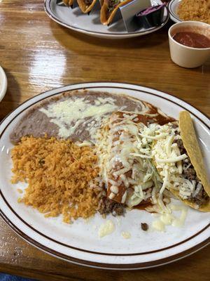 Combination taco, enchilada, rice and refried beans.