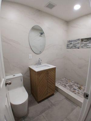 Full bathroom remodel including framing, electrical, plumbing, tile and accessories.