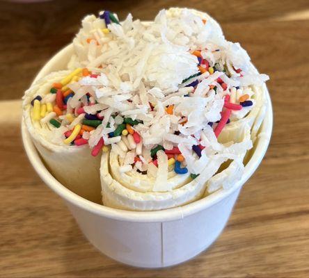Banana gelato with sprinkles and coconut