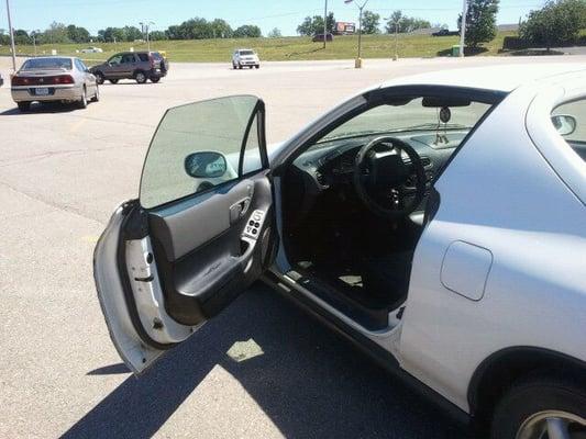 This door was stuck broken SHUT for 4 months. Took my car to Smart Car for an oil change, and LOOK! :)