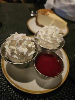 Whipped cream and cranberry orange sauce for the cheesecake