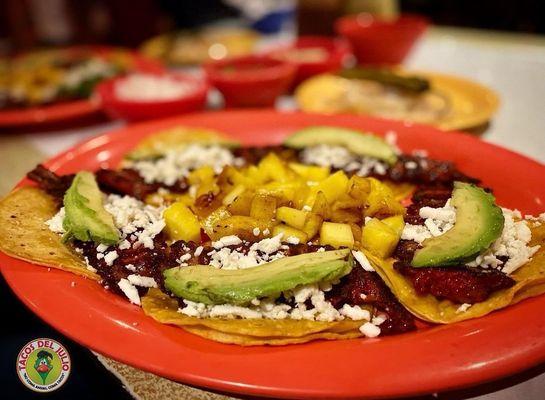 Savor the iconic blend of sweet and savory with our trompo tacos topped with juicy pineapple!