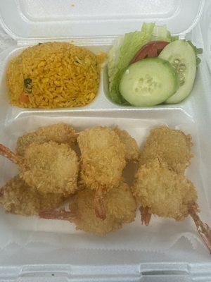 Shrimp, fried rice and veggies.