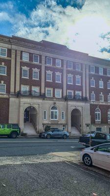 The budling we are located at, Just come to the archway to the left "Boys" and knock.