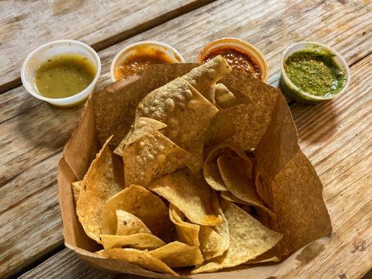 Salsas left to right: sweet tomatillo, red tomato, spicy peanut, and "don't call me chimichurri"