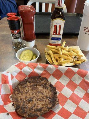 Single patty with seasoned fries and a side of pickles - Delicious !!! Used A-1 !!!