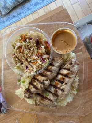 Chicken skewers, sesame ginger slaw and a peanut sauce
