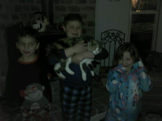 The kids with October the cat.