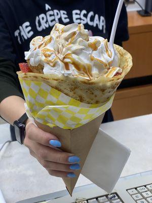 Strawberry Banana Crepe with vanilla sauce, almond, caramel and whipped cream Deee-licious