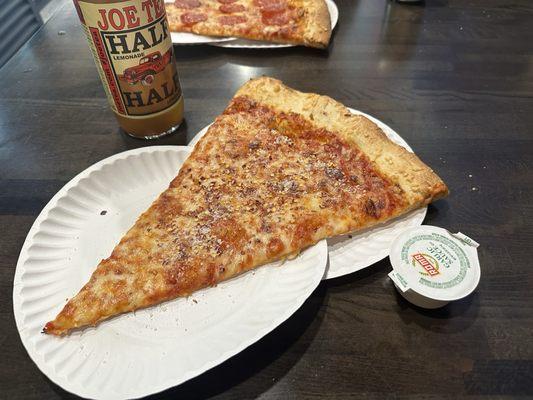 Cheese slice with garlic sauce cup, and a joe tea