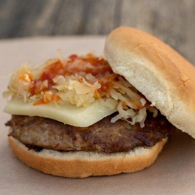 The Notorius P.I.G. a true Ham Burger served Farmers Style with local cheese, organic Kraut and Millers Mustard- you can add a fresh egg