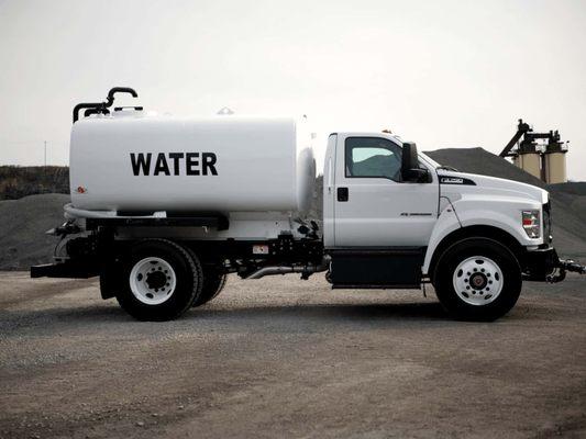Professional bulk water truck used for pool filling and construction site watering.