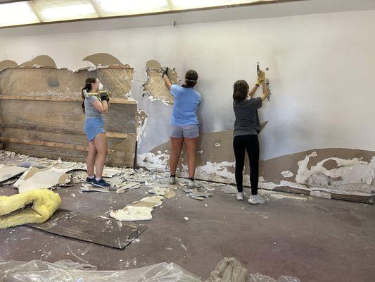 DLHS Youth Assisting with Demo in the newly acquired building.