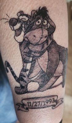 Tigger & eeyore.....a good representation of my wife and myself along with our anniversary date on the banner below.