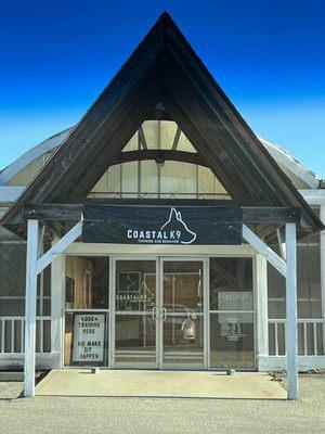 Entrance to Coastal K9. The potty area is to the right behind the white fencing.