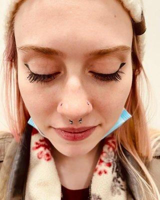 Nose piercings on both sides of nose and a septum piercing. Almost Famous Body Piercing in Bloomington, Minnesota