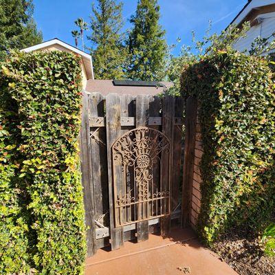 Wooden entry gate, before, iron gate after.