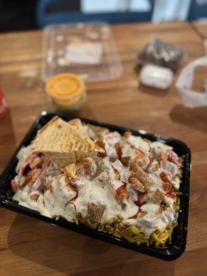 Chicken over rice with all the Powers ! Sauce is optional! Or you can get it on the side. Great Taste and very fresh.