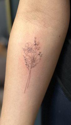 Orchid bouquet tattoo