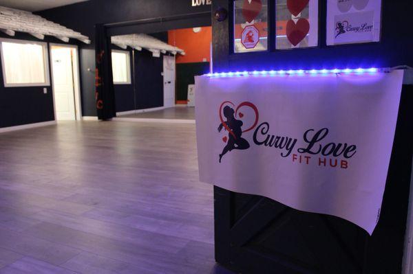 Glimpse of studio floor looking through front entrance.