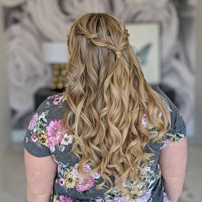 Loose curls with a half up braid