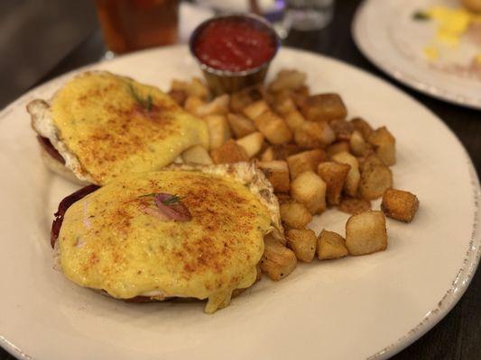 Eggs Benedict with Capicola and eggs fried over medium.