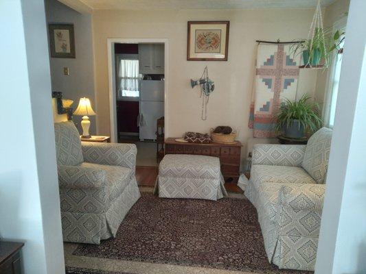 Loveseat, overstuffed chair, and ottoman with new upholstery