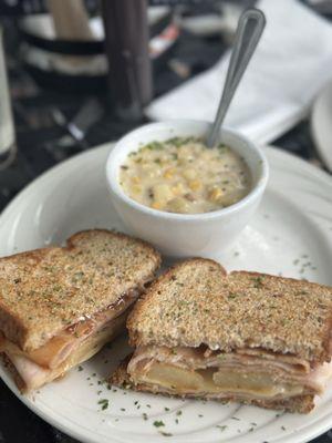 Autumn Turkey Sandwich + Soup Grilled turkey, Swiss cheese, apple, raspberry jam, and twelve-grain bread.