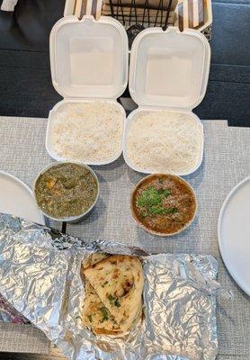 Palak paneer and lamb curry with garlic naan. Regular sized containers with x1 piece of naan.