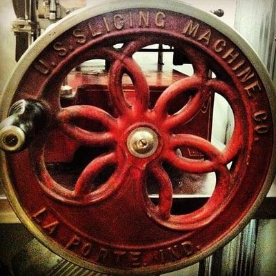 The antique Van Berkel hand crank slicing machine.