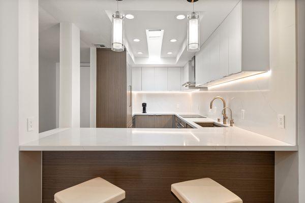 A blend of form and function. This West Hollywood modern kitchen and living room makes an iconic statement in every detail.