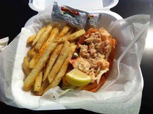 Lobster roll with fries.