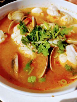 Seafood noodle soup..Very fresh and abundant with clams, calamari, scallops and shrimp. Very flavorful broth!