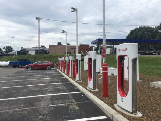 Tesla Superchargers behind Irving station, around back with the truck parking