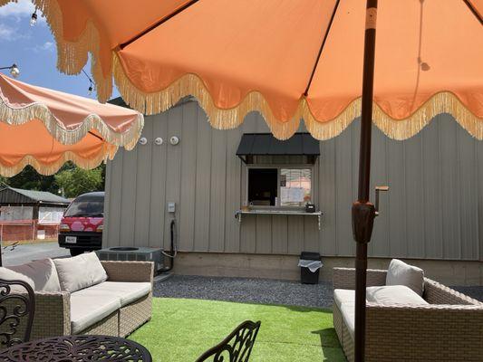 Outdoor sitting area...3 tables and two couches.