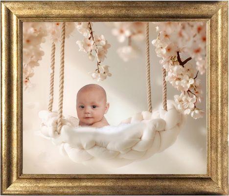 16x20 framed and mounted wall portrait of baby.