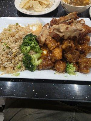 Two meat dinner box, peanut butter chicken and general this chicken