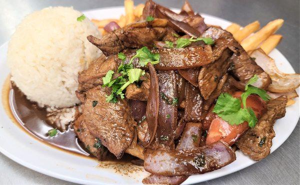 Lomo Saltado, with Rice and Fries.