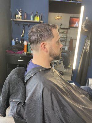 Low fade with a sideburn taper & beard edge up