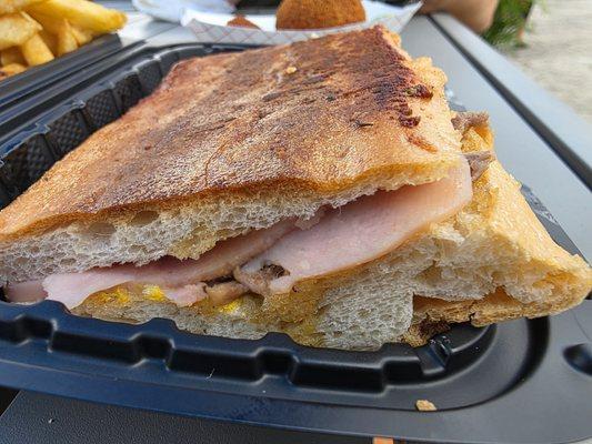 Ham, roast pork, cheese, pickle and mustard. The bread is amazing.
