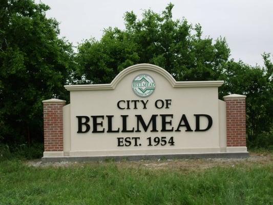 Monument sign: brick, stucco, dimensional lettering