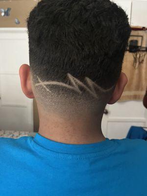 I got this hair cut a drop fade and a lineup and off the top and a design