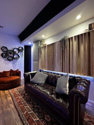 Control Room B rear facing view with leather couch.