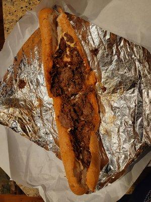 Sub not toasted, has steak sauce not chopped up steak, cheese not melted, and maybe is half-way filled.  And the forgot the onions