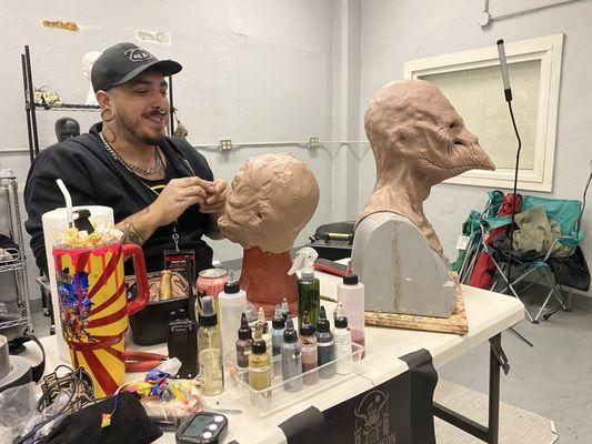 Makeup artist at work creating original design