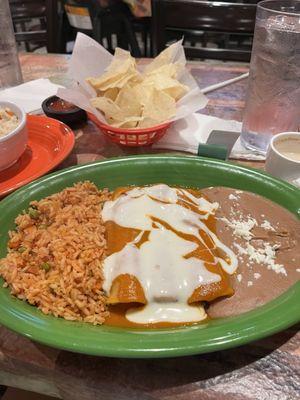 Chicken enchiladas, refried beans, rice