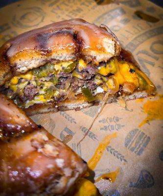 "Love at first bite" Wagyu Smashburger with American Cheese, Sautéed onions, Jalapeños, Grilled egg served on 2 Cinnamon Sticky Buns