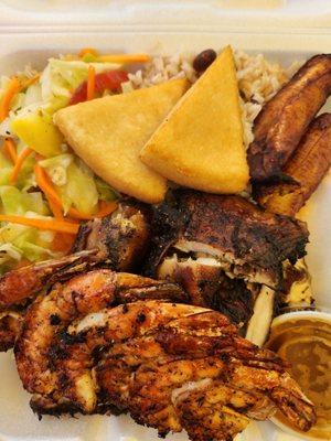 Jerk chicken dinner with coconut rice & beans, cabbage & sweet plantain. I ordered a side of jerk butter shrimp skrewer.